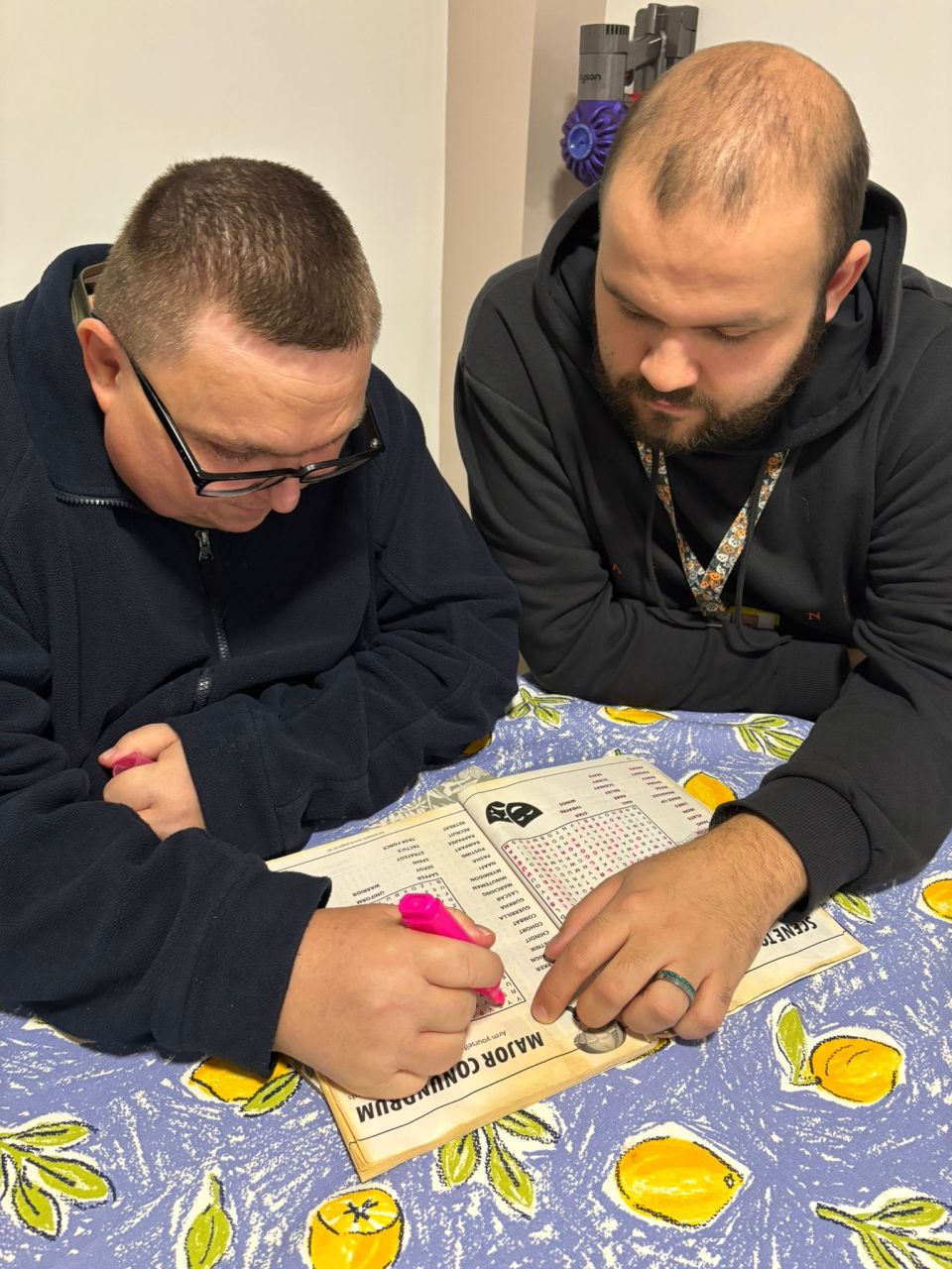 Resident Shaun, completing a word search with Sam